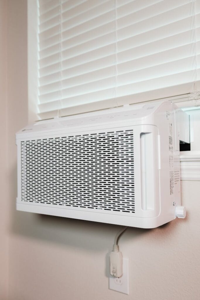 pexels-photo-16592625 Wall-mounted air conditioner installed in a residential setting, providing cooling comfort.
